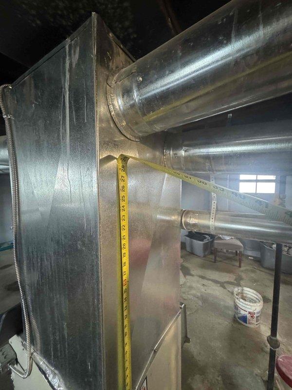 Conducted site assessment for furnace replacement due to no heat issue. Existing unit is a Plus 80E model less than one year old located in basement with natural gas connection. Measured ductwork dimensions and evaluated current installation configuration to prepare appropriate replacement estimate.