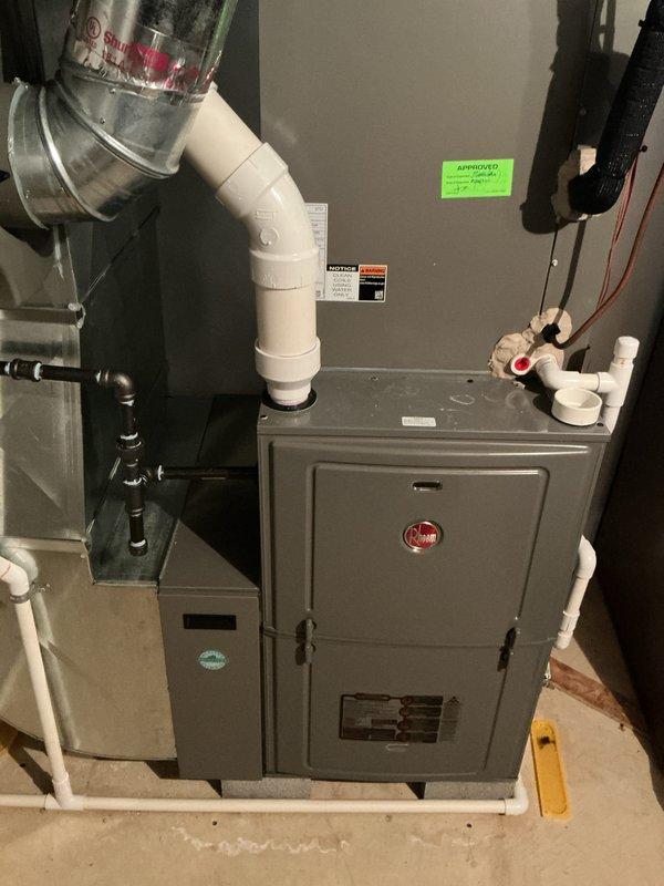 Performed annual preventative maintenance on 2-year-old Rheem forced air furnace system. Completed comprehensive tune-up including inspection of all components, venting, and connections. System is operating properly with no issues identified; customer's complimentary maintenance service completed successfully.