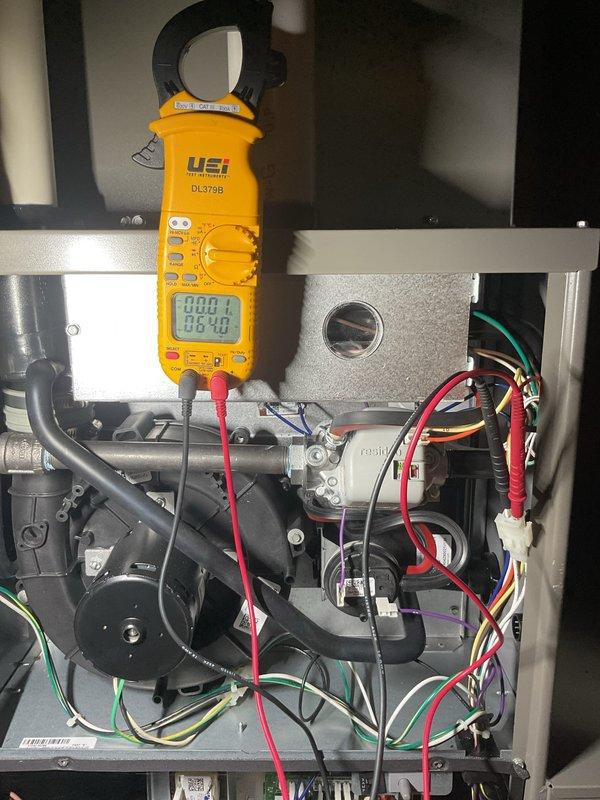 Performed scheduled Air Care Heating maintenance service with comprehensive system diagnostics. Conducted electrical testing using UEi DL379B clamp meter, measuring amperage draws of 0.38-0.40 on the blower motor assembly. Replaced furnace filter as part of routine maintenance protocol.