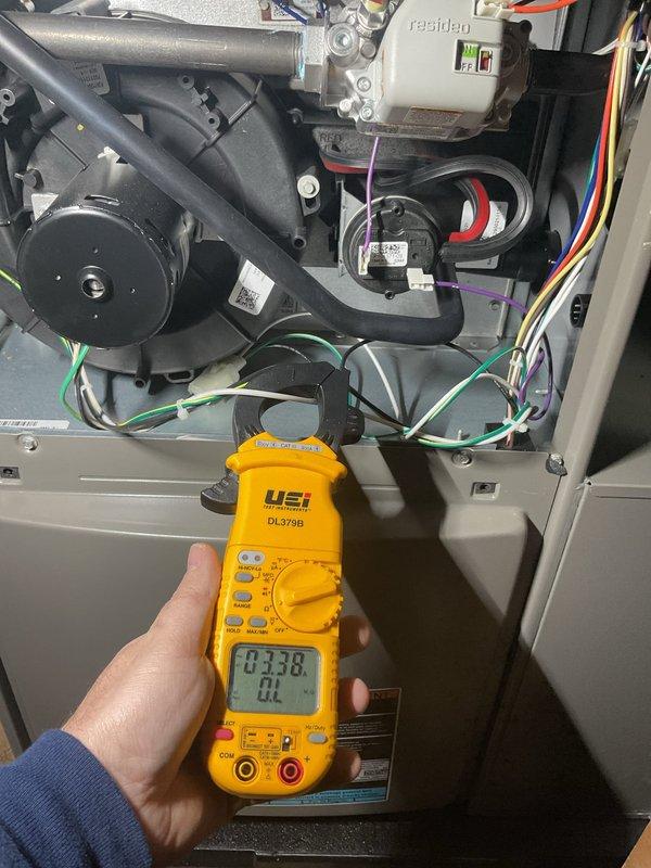 Performed scheduled Air Care Heating maintenance service with comprehensive system diagnostics. Conducted electrical testing using UEi DL379B clamp meter, measuring amperage draws of 0.38-0.40 on the blower motor assembly. Replaced furnace filter as part of routine maintenance protocol.