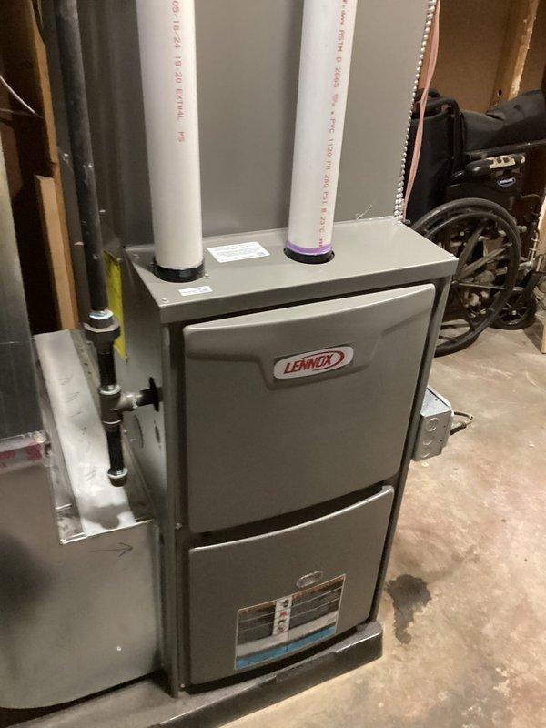 Performed annual maintenance on Lennox furnace (0 years old, CM: 2025). Inspected all internal components including motor, electrical connections, and exhaust/intake PVC piping. Unit is functioning properly with no issues identified; completed standard tune-up procedures and documented service with photos of system interior and exterior installation.