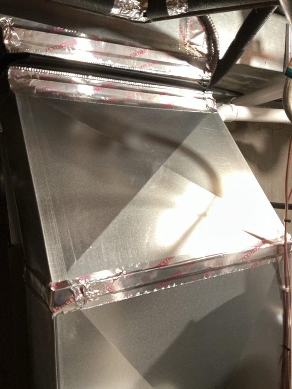 Installed return transition in existing HVAC system, connecting rectangular metal plenum to the air handler. Sealed all ductwork connections with foil tape to ensure proper airflow and system efficiency.