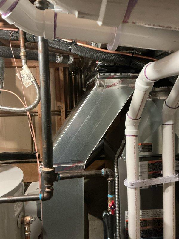 Installed return transition in existing HVAC system, connecting rectangular metal plenum to the air handler. Sealed all ductwork connections with foil tape to ensure proper airflow and system efficiency.