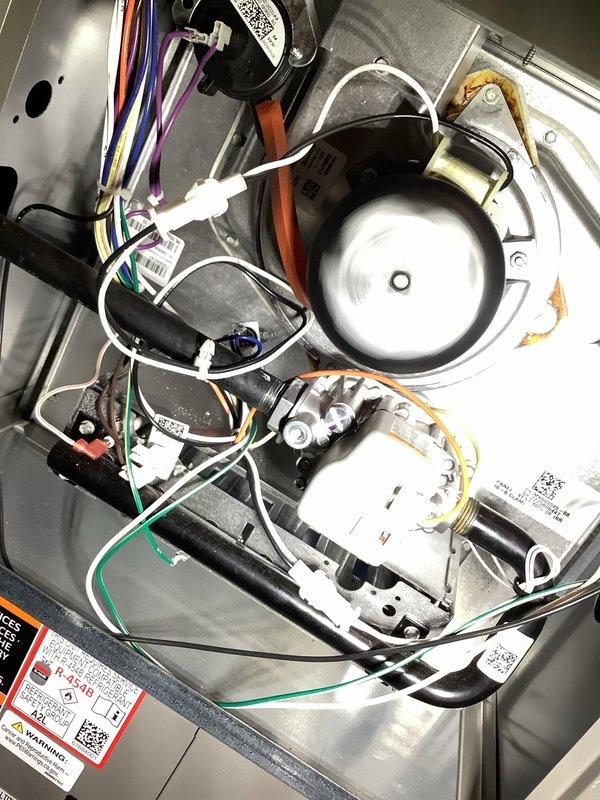 Completed annual furnace maintenance per membership agreement. Inspected blower motor assembly, electrical connections, and control components, documenting all in satisfactory working condition. Noted copper pipe with visible corrosion and greenish discoloration at fitting connection point, which should be monitored for potential future service needs.