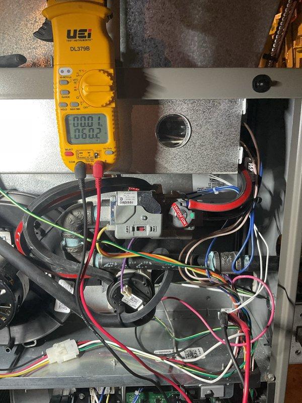 Performed annual furnace maintenance as part of membership service on properly functioning system. Conducted comprehensive diagnostic testing using UEi DL379B multimeter on control board circuitry and electrical components. Inspected and verified proper voltage readings across terminals with all connections secure and operating within manufacturer specifications.