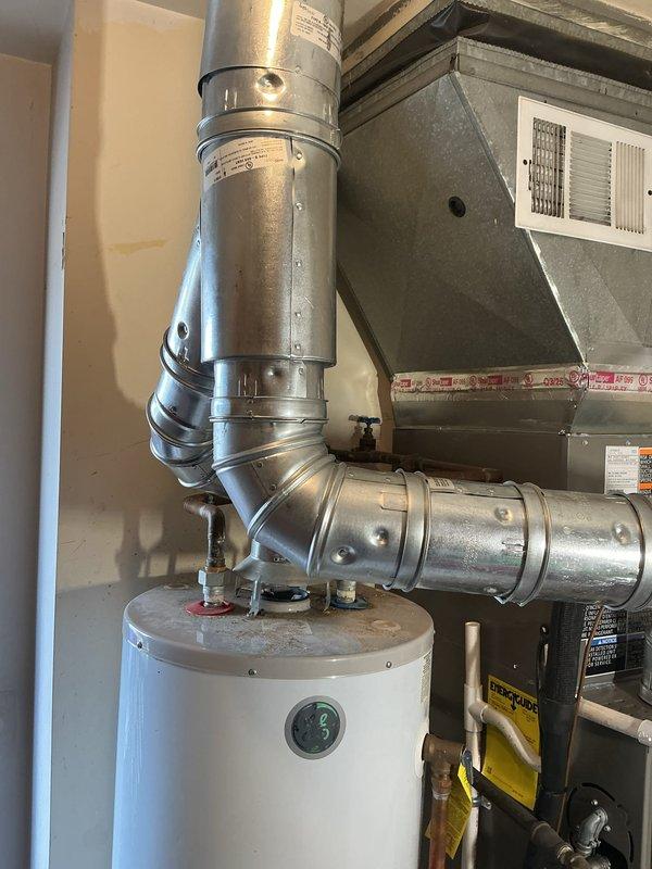 Successfully completed installation of a complete HVAC system, including a 70,000 BTU furnace and 1.5-ton AC unit with rear placement. System features a new Lennox furnace mounted on platform with proper ductwork connections, including installation of required mechanical and electrical components with all permits secured.