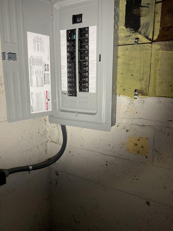 Successfully completed a 100-amp panel replacement service. Installed new circuit breaker panel with proper permits, replacing the existing panel mounted on concrete block wall. All connections were properly terminated and system was tested for functionality.