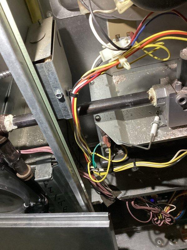 Performed annual furnace maintenance on a 0-year-old system as requested. Conducted comprehensive inspection of internal components including blower motor, electrical connections, and control modules with all wiring (yellow, red, white, blue) found in proper working condition. System was thoroughly cleaned of accumulated dust/debris and verified proper operation; unit is functioning correctly with next maintenance recommended in 2025.