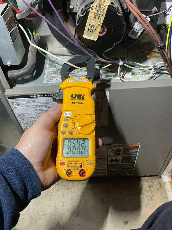 Performed annual furnace maintenance tune-up on CM:2025 unit. Conducted electrical testing with UEi DL379B clamp meter, measuring amp draw on components (readings: 0.542A and 8.63A). Inspected internal wiring and components including blower motor and verified proper electrical connections.