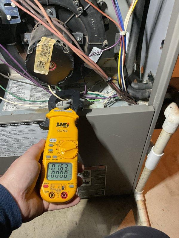 Performed annual furnace maintenance tune-up on CM:2025 unit. Conducted electrical testing with UEi DL379B clamp meter, measuring amp draw on components (readings: 0.542A and 8.63A). Inspected internal wiring and components including blower motor and verified proper electrical connections.