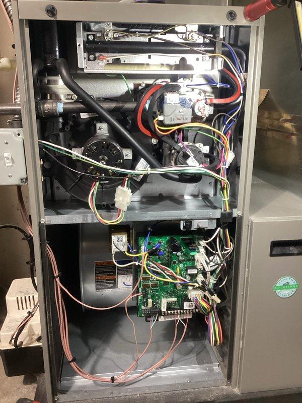 Performed annual heating maintenance service on Lennox system. Inspected thermostat functionality, confirming proper operation in heating and humidifying modes with winter settings programmed correctly. Examined interior components including blower motor, electrical connections, and circuit board, all found to be in good working condition with no issues detected.