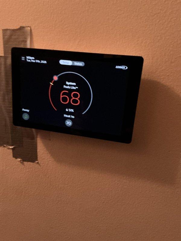 Responded to no-heat call for 7-year-old furnace that was blowing cold air. Diagnosed and repaired faulty thermostat which was displaying "black" screen prior to service. Confirmed system now operating correctly with heat output reaching setpoint of 70°F, with current temperature reading 68°F.
