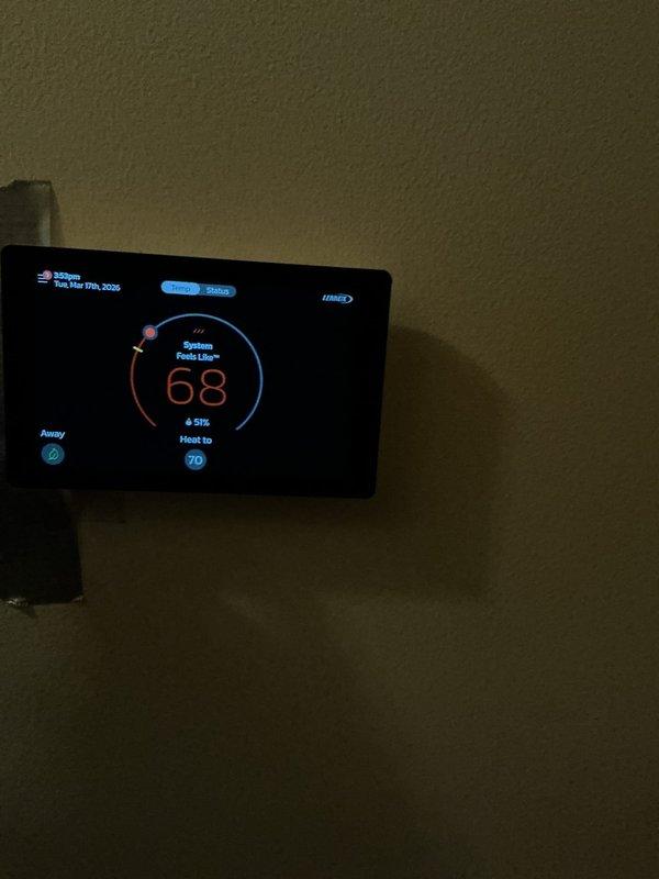 Responded to no-heat call for 7-year-old furnace that was blowing cold air. Diagnosed and repaired faulty thermostat which was displaying "black" screen prior to service. Confirmed system now operating correctly with heat output reaching setpoint of 70°F, with current temperature reading 68°F.