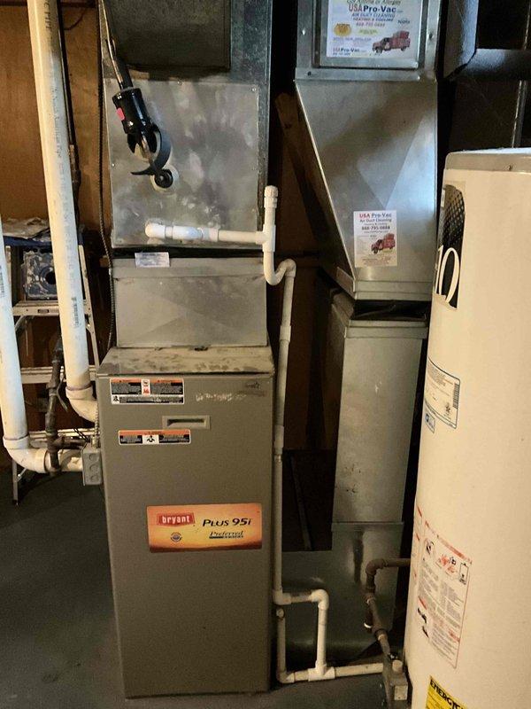 Completed service estimate for replacement of 16-year-old Bryant Plus 90 gas furnace and water heater located in basement. Current equipment is operational but aging. Documented existing installation including ductwork configuration, PVC ventilation system, and connection points to prepare comprehensive replacement proposal for high-efficiency alternatives.