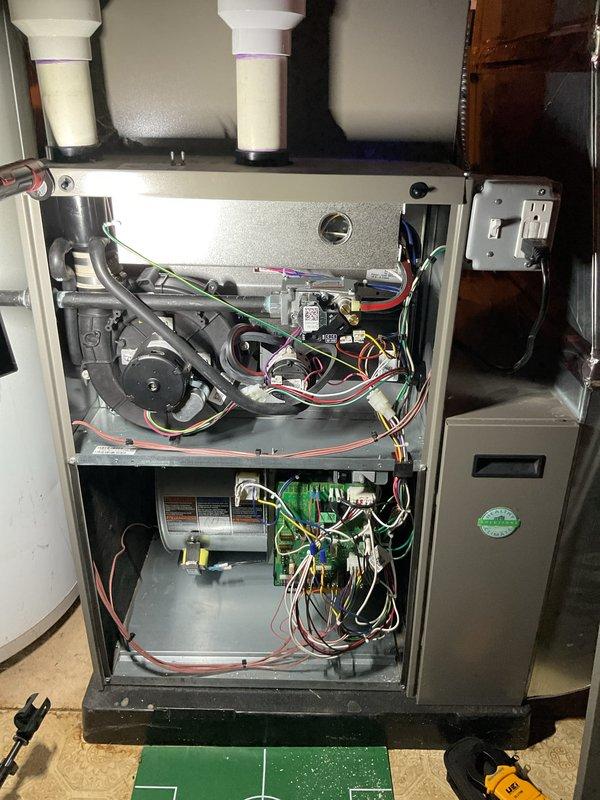 Performed annual heating maintenance on furnace system as part of customer's membership. Conducted comprehensive inspection with internal component examination, including visual inspection of wiring harnesses and circuit board. Completed electrical testing with clamp meter to verify proper amp draw (0.46) on system components, ensuring optimal operation for the upcoming heating season.