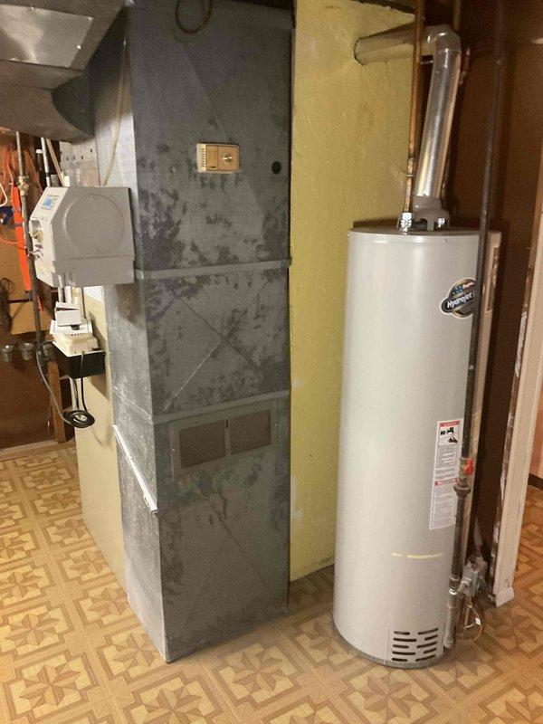 Conducted full system estimate on 21-year-old Amana HVAC system. Inspected aging furnace showing significant wear and examined gas valve connections. System has reached end of serviceable life and replacement is recommended based on age, condition, and efficiency concerns.