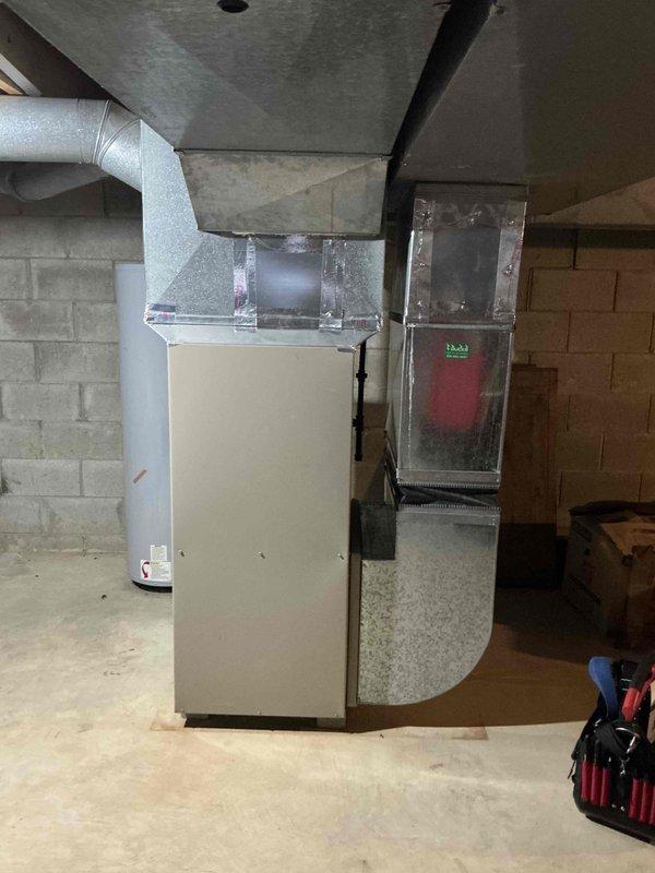Conducted full system assessment of 30-year-old HVAC equipment in basement of Colonial home with forced air heating operating on natural gas. Documented existing furnace unit with connected metal ductwork system and inspected electrical service entrance, including meter installation and associated conduits. Quote prepared for complete furnace and air conditioning replacement.