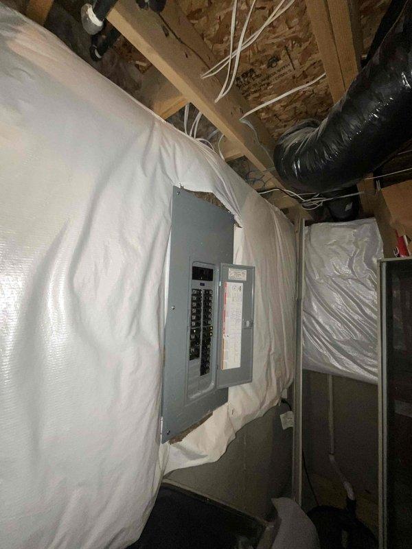 Completed electrical estimate for a new Generac whole home generator installation. Inspected the existing electrical panel in an unfinished basement area, which features a digital power monitoring display and dual columns of circuit breakers. Documentation of the current electrical setup was captured to inform proper generator sizing and connection requirements.