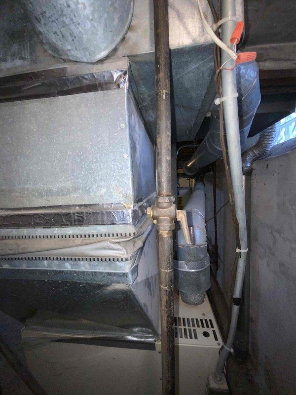 Completed inspection of a 15-year-old non-operational furnace located in the basement. Documented existing HVAC system configuration including ductwork, ventilation piping, and connections to water heater. Provided replacement estimate for new furnace under current BOGO air conditioning promotion.