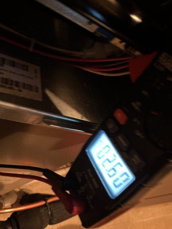 Conducted diagnostic testing on HVAC system using digital multimeter to verify electrical parameters. Performed voltage measurements on internal components, recording readings of 0.00V and 05.4V at various connection points. Inspected wiring integrity and component connections throughout the air handler unit during annual maintenance service.