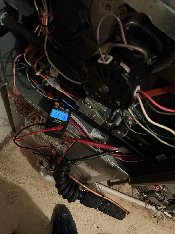 Conducted diagnostic testing on HVAC system using digital multimeter to verify electrical parameters. Performed voltage measurements on internal components, recording readings of 0.00V and 05.4V at various connection points. Inspected wiring integrity and component connections throughout the air handler unit during annual maintenance service.