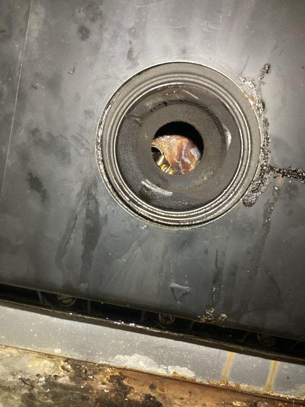 Diagnosed control board failure in forced air furnace preventing thermostat communication. Found 24V power to board but no output signal, resulting in no heat. Visual inspection revealed possible water damage and corrosion around drainage components, with mineral deposits affecting mechanical operation of the system.