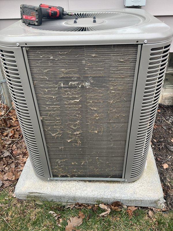 Performed annual furnace maintenance as part of membership agreement. Conducted electrical testing using UEi DL379G multimeter, measuring amp draw on system components. Noted significant debris accumulation on outdoor condenser coil requiring cleaning to prevent efficiency loss and potential system damage.