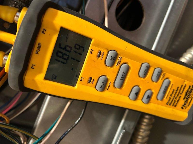 Responded to service call for 2017 furnace with error code and insufficient heating. Diagnostic testing with manometer revealed pressure readings of 186/19, indicating improper gas pressure. Adjusted gas valve settings and verified proper operation of all components, restoring normal heating function and clearing error code.