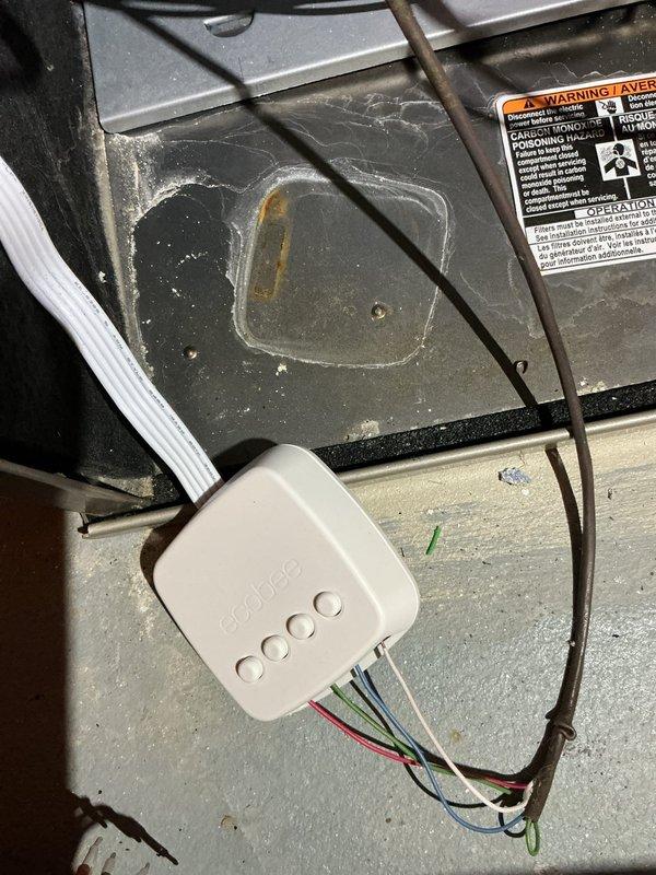 Installed customer-supplied Ecobee thermostat and troubleshooted system issue where condensing fan was activating during heat calls. Verified wiring connections at the circuit board and thermostat, ensuring proper terminal configuration for separate heating and cooling operations. System now functioning correctly with appropriate sequencing of components.
