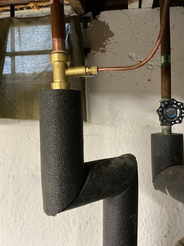 Completed installation of a complete HVAC system including a 70,000 BTU furnace, 2-ton air conditioning unit, and humidifier. Performed all necessary mechanical and electrical connections, secured required permits, and documented the installation with photos of the completed plumbing components featuring properly insulated copper lines and functioning shut-off valves.