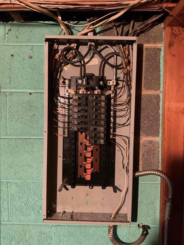 Diagnosed and repaired power outage affecting two back bedrooms by identifying faulty circuit breakers in the main electrical panel. Inspection revealed loose connections at the breaker terminals which were tightened and tested, successfully restoring electrical service to all affected areas.