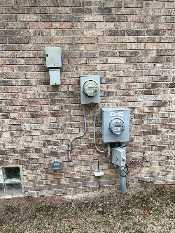Successfully completed installation of a complete HVAC system including a 90,000 BTU furnace and 3-ton air conditioning unit. The outdoor condenser was properly mounted on a concrete pad against the exterior brick wall with all electrical connections secured. Mechanical and electrical permits were obtained, and all utility connections were properly established with the existing metering system.
