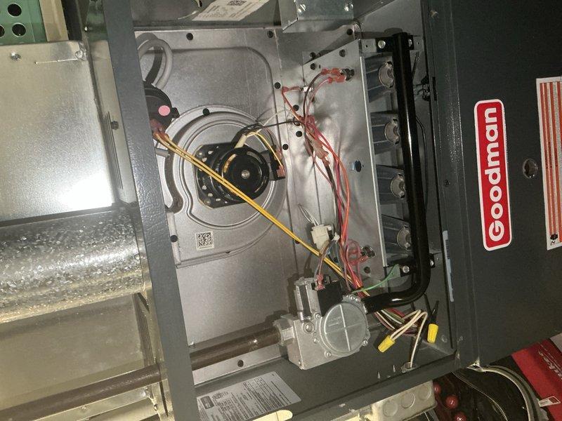 Performed annual heating maintenance check on Goodman air handler system. Inspected interior components including blower motor, electrical connections, and control systems. All components found to be in normal working condition with some dust accumulation; no issues requiring immediate attention were identified.
