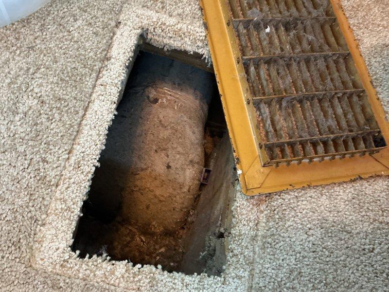 Responded to service call for insufficient airflow to second floor. Inspected 10-year-old forced air furnace system and found significant dust and debris accumulation in ductwork affecting proper air distribution. Cleaned accessible duct sections to restore proper airflow to upper level and verified proper thermostat operation in heating mode.