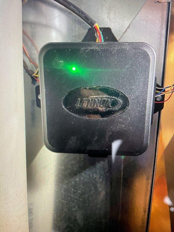 Responded to callback regarding inspector's concern about gas detection mitigation system placement. Verified that the system is properly installed inside the Lennox unit as per manufacturer specifications, not outside as initially reported by inspector. Documented the installation with photos showing the correctly installed and functioning control module with illuminated status indicator.