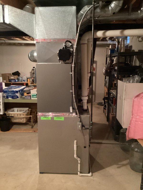 Successfully completed installation of a 3.5-ton A/C unit with matching coil in rear location. System includes new furnace with proper ductwork connections and PVC condensate drainage. All mechanical permits were secured, and final connections were made according to manufacturer specifications.
