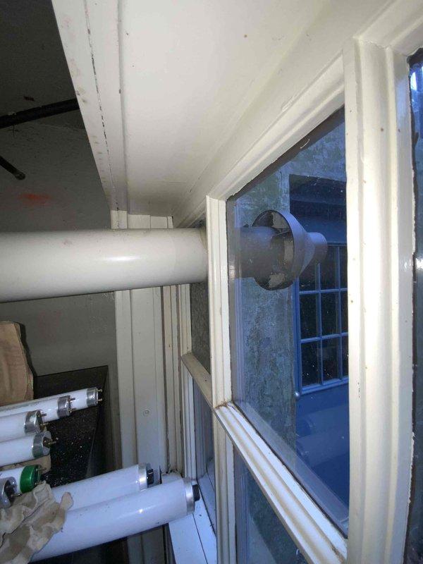 Completed estimate for furnace replacement with photos documenting the existing PVC venting configuration through window frame and the exterior brick/concrete wall condition where installation will occur. Quote includes future air conditioning addition scheduled for June 2025.