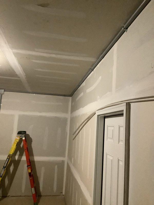 Responded to callback for electrical safety concerns during HVAC installation. Protected exposed SE cable and installed proper conduit system including PVC piping, elbows, fittings, and junction boxes. Addressed drywall damage around newly installed 3.5-ton A/C unit and coil.