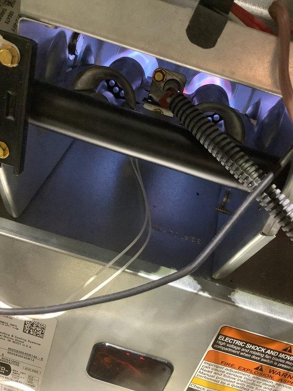 Performed scheduled Air Care Cooling and Heating maintenance service. Inspected furnace components including blower motor, electrical connections, and control board, all found to be in normal working condition with no visible damage or abnormal wear. Verified proper gas combustion with healthy blue flames in the combustion chamber and no issues detected.