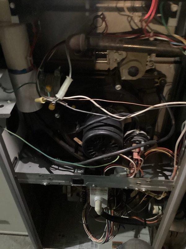 Performed annual heating maintenance on furnace as part of customer's membership program. Conducted comprehensive inspection of internal components including blower assembly, wiring connections, and control mechanisms. Verified proper operation of ignition system as evidenced by normal blue flame pattern during startup sequence.