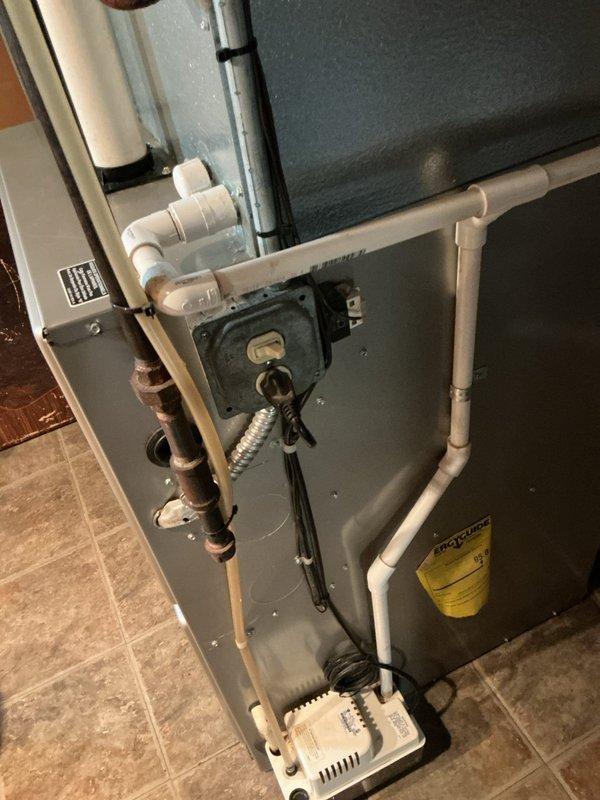 Performed scheduled Air Care Maintenance service on residential HVAC system. Inspected condensate drain system, condensate pump, and checked control components for proper operation. Examined air filter with honeycomb pattern which appeared to be in serviceable condition; no replacement needed at this time.