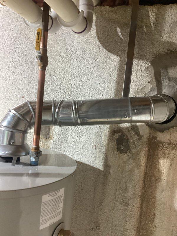 Successfully installed a new 40-gallon tanked water heater with proper mechanical connections. Completed all necessary piping work including copper and PVC connections with appropriate valving. Installed and connected ventilation ductwork with galvanized steel including elbow joint for proper exhaust routing.