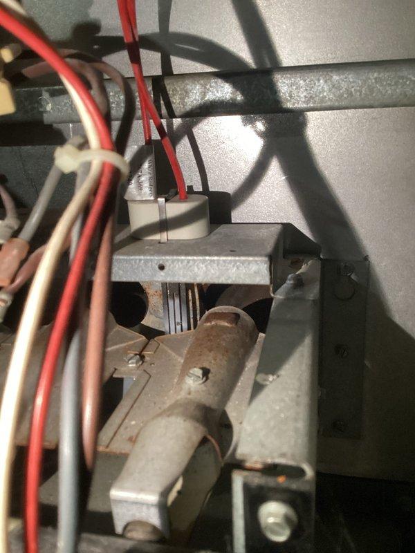 Diagnosed 20-year-old furnace with no heat issue despite normal blower operation. Inspection revealed faulty limit switch connections with visible corrosion and damaged wiring at the control board terminal. Replaced limit switch assembly, restored proper electrical connections, and verified system operation through complete heating cycle testing.