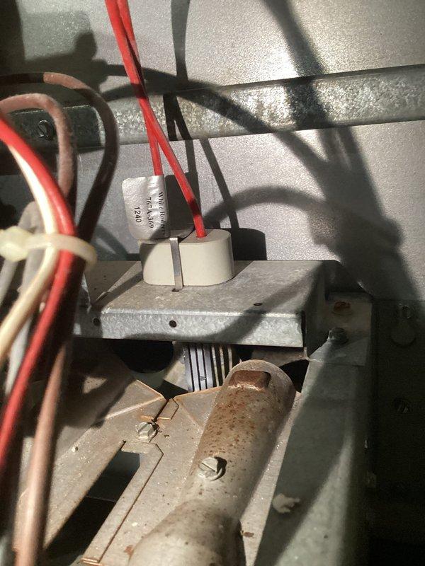 Diagnosed 20-year-old furnace with no heat issue despite normal blower operation. Inspection revealed faulty limit switch connections with visible corrosion and damaged wiring at the control board terminal. Replaced limit switch assembly, restored proper electrical connections, and verified system operation through complete heating cycle testing.