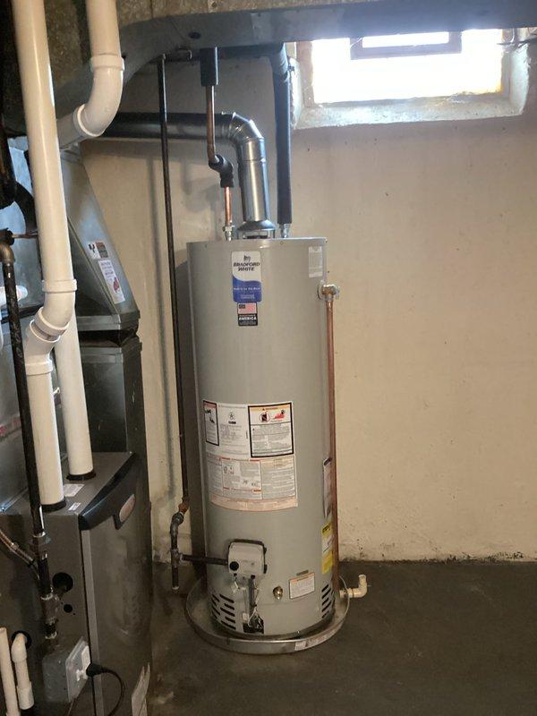 Completed installation of new complete HVAC system including a 70,000 BTU furnace and water heater. System was properly connected with appropriate vent piping, PVC connections, and copper plumbing lines. All mechanical, plumbing, and electrical work was completed with proper permits obtained and all manufacturer specifications followed.