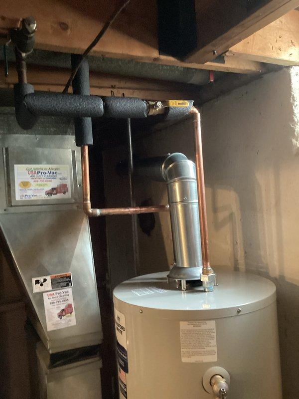 Completed installation of new complete HVAC system including a 70,000 BTU furnace and water heater. System was properly connected with appropriate vent piping, PVC connections, and copper plumbing lines. All mechanical, plumbing, and electrical work was completed with proper permits obtained and all manufacturer specifications followed.