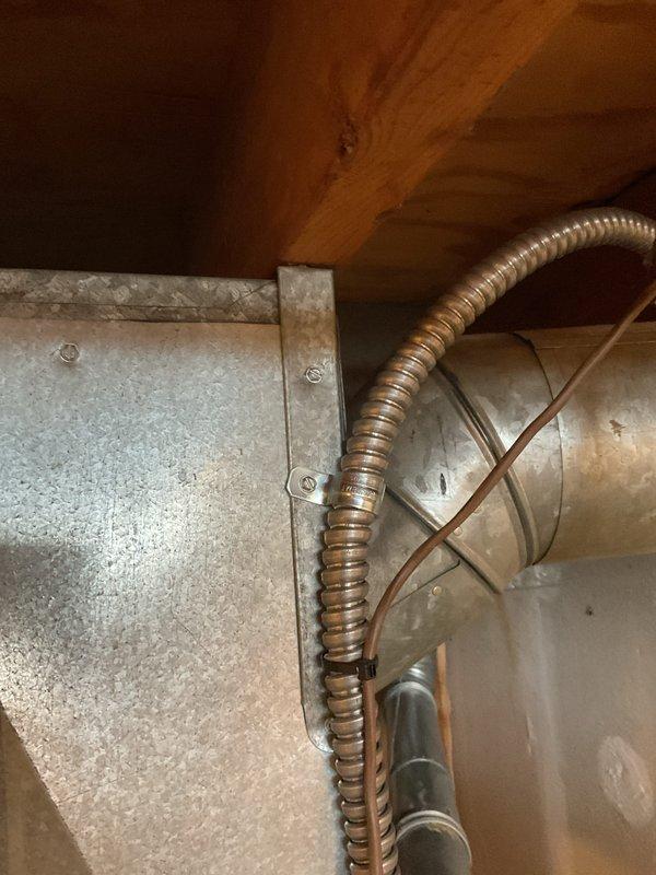 Completed installation of 70,000 BTU furnace and 2.5 ton AC system with humidifier. Addressed potential recall violation by providing required 1" clearance to combustibles above the plenum per safety standards. Completed all necessary mechanical reconnections and documented installation with verification photos.