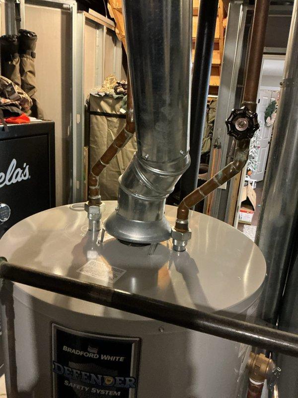 Performed diagnostic service on Bradford White Defender water heater showing no water flow. Completed thorough drain, clean and flush procedure to remove sediment buildup and restore proper operation. System now functioning correctly with all connections verified and tested.
