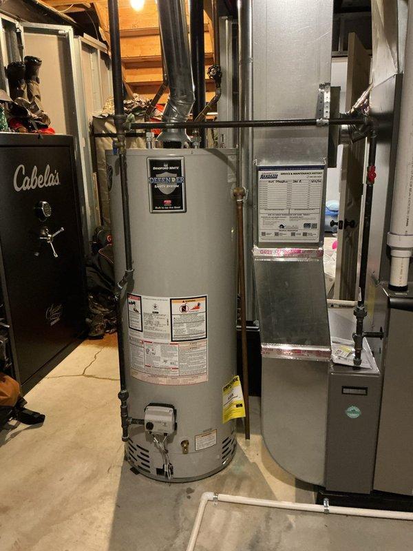 Performed diagnostic service on Bradford White Defender water heater showing no water flow. Completed thorough drain, clean and flush procedure to remove sediment buildup and restore proper operation. System now functioning correctly with all connections verified and tested.