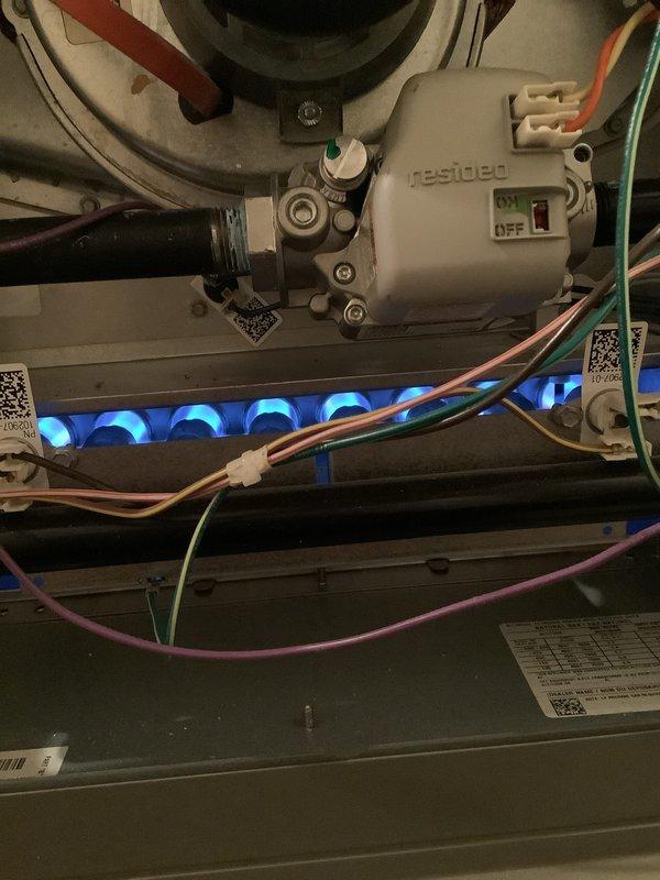 Performed routine air handler maintenance on recurring service contract with Air Care Heating. Inspected burner assembly, confirming proper flame pattern and operation of Resideo control module. Examined blower wheel and motor assembly, checked all electrical connections, and verified proper operation of all system components.